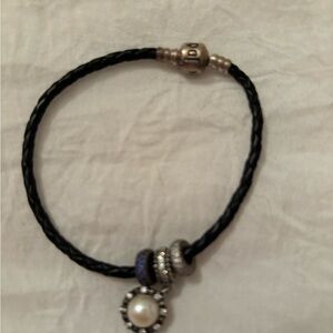 Black braided pandora bracelet with three charms